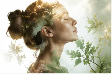 Woman's profile blended with leaves and branches